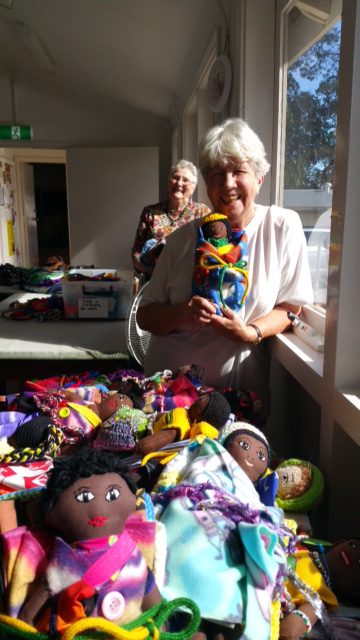 Doris Van Keulen and Jill Bygott happily packing dolls for lifeline in KwaZuluNatal