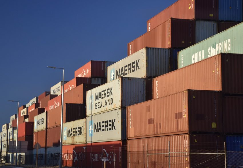 Over Rous Head way, containers in the setting Sun.